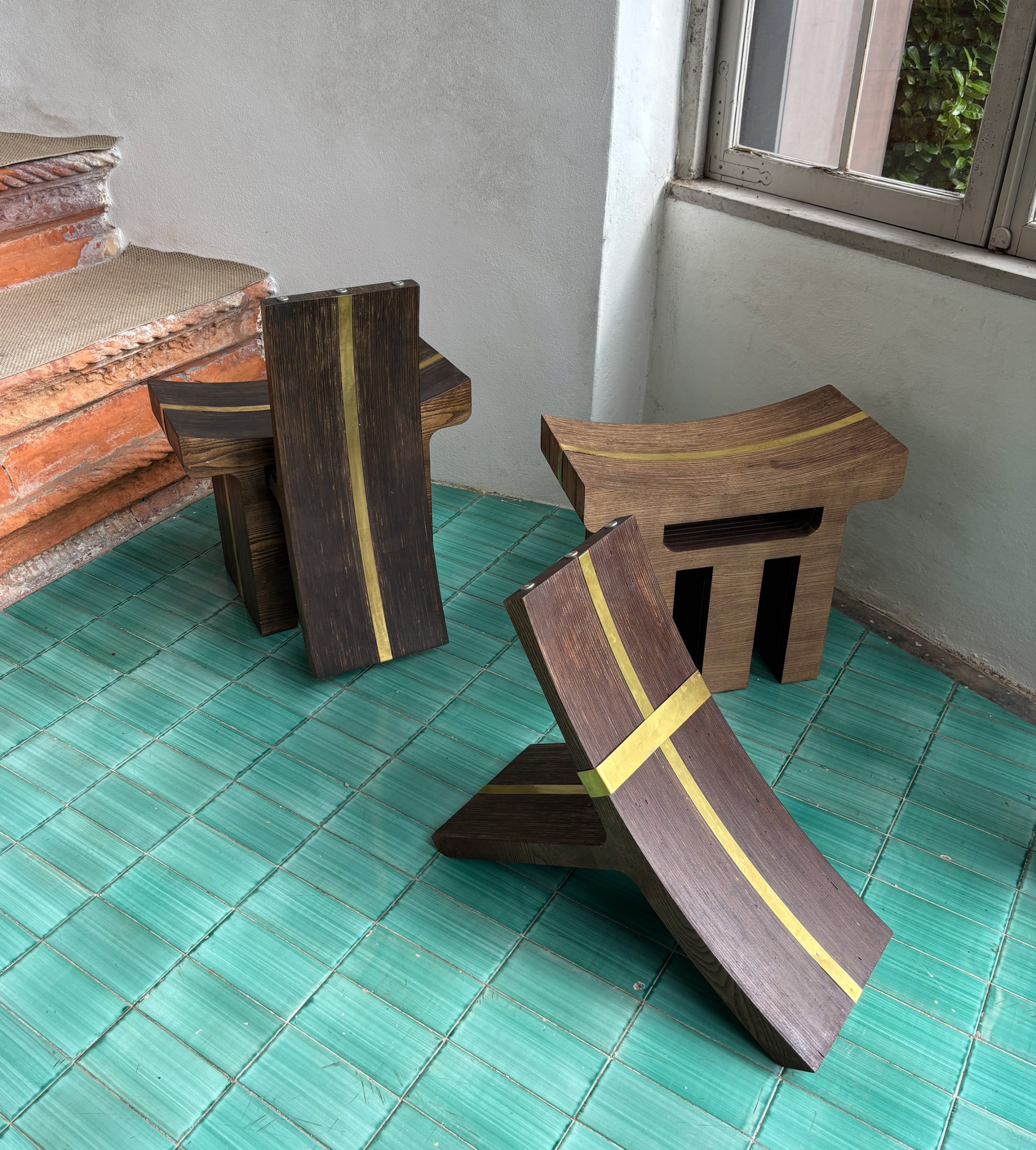 Modular chair components on a blue tiled floor
